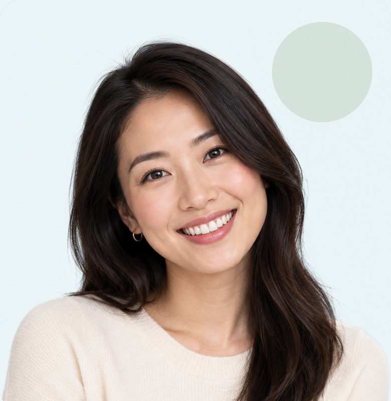 Smiling woman with long dark hair looking comfortable